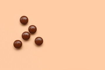 Brown medical pills on beige background