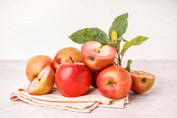 Fototapeta na wymiar Sweet pink apples and leaves on white background