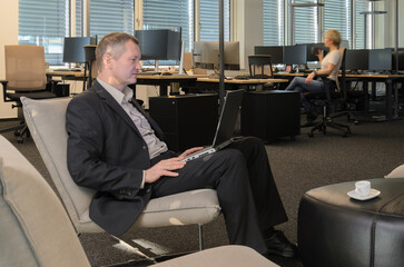 Employees at work in a modern IT office