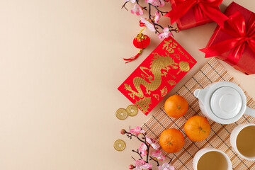 Engaging in the chinese New Year Tea ceremony tradition. Top view photo of teapot, cups of tea,...