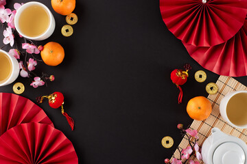 Creative concept for the chinese New Year tea ritual. Top view shot of teapot, cups of tea,...