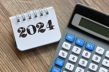 New year resolutions 2024 on desk. 2024 goals list with notebook. Resolutions, plan, goals, action,...
