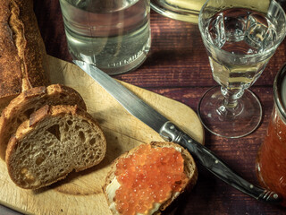 Antique-style still life with vodka and red caviar. - 701962662