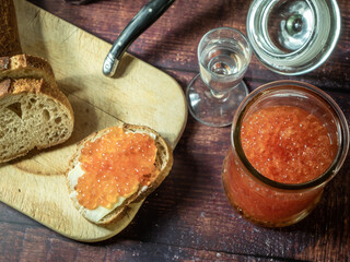 Antique-style still life with vodka and red caviar. - 701962803