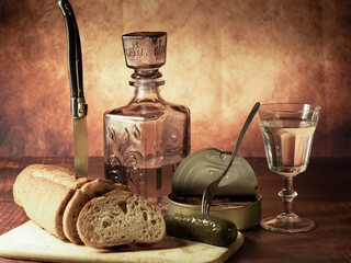 Antique-style still life with alcohol, vodka, canned fish, bread and cucumber. - 701962818