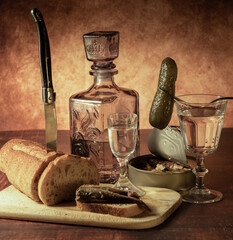 Antique-style still life with alcohol, vodka, canned fish, bread and cucumber. - 701962855