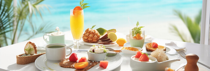 beautiful breakfast on a beach with fruit and a croissant - obrazy, fototapety, plakaty