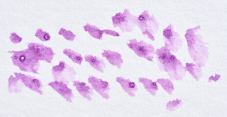 Drawn dots with acrylic purple paint on a white  background