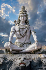 Shiva statue on the banks of the sacred Ganges River in Rishikesh, India.	
