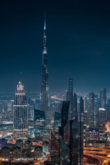 Futuristic Dubai skyline at night, United Arab Emirates (UAE).