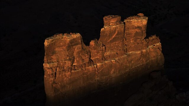 Aerial view of unique rock formation in shadow