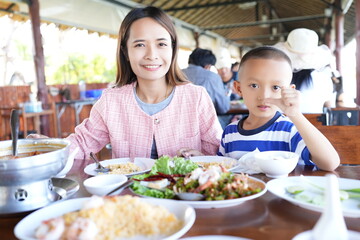 Mother and child eat happily