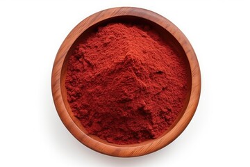 Red sumac powder arranged in a flat lay view on a wood plate isolated on a white background A pile of isolated sumac powder
