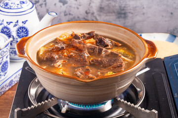 The delicious braised mutton hot pot.   
