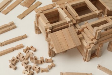 Wooden construction set on white table, closeup. Children's toy