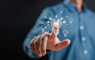 Hand man holding illuminated lightbulb, idea, innovation and inspiration, smart business...