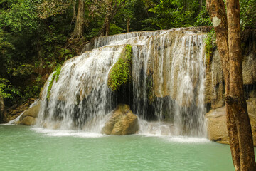 Fototapeta na wymiar Waterfall in forest at Erawan waterfall National Park, Kanchanaburi, Thailand