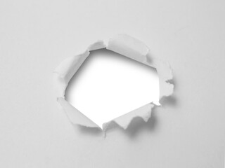 Ragged hole on ripped paper, cut out isolated