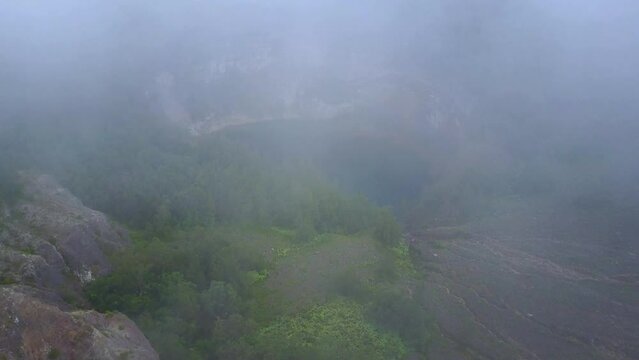 Early morning misty aerial view of the Kelimutu three colored lakes in East Nusa Tenggara, Indonesia.