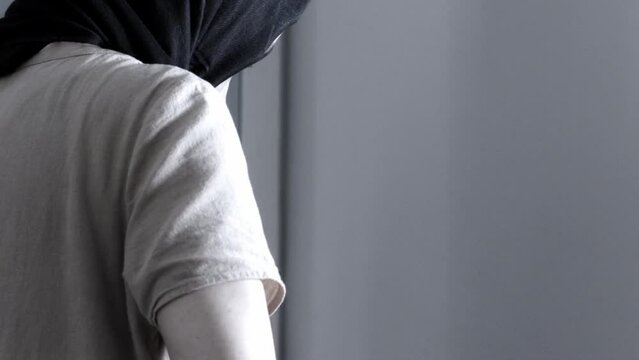 Muslim woman ironing - female doing domestic chores