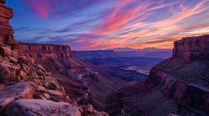 Canyon landscape with sharp angles and smooth curves, showcasing the dynamic twilight sky
