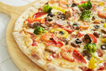 pizza on a wooden board	