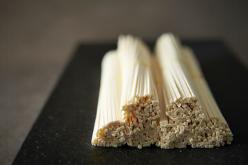 Dried noodles on dark background	