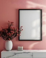 Portrait blank white picture frame on desk or table with plant pink flower decoration and pink background, sunlight, copy space, mockup.