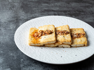 Seasoned grilled tofu on a plate