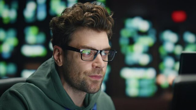 Inspired software developer working computer technical room closeup. Happy man