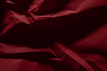Red old crumpled paper texture in low light background,wrinkled paper - 702025635