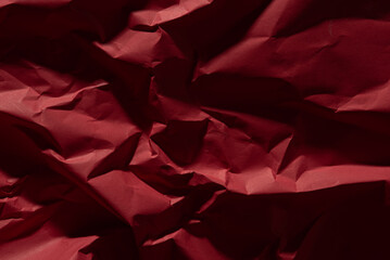 Red old crumpled paper texture in low light background,wrinkled paper - 702025647