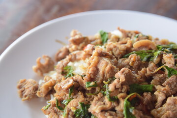 Pad beef Thai cultural food, Spicy stirred fry beef with basil leaf.