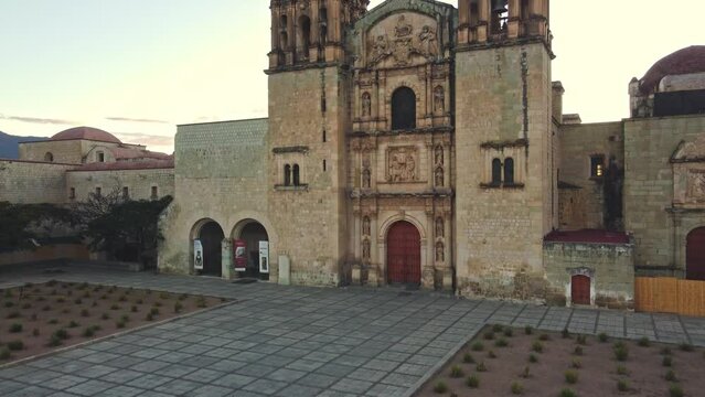 backwards drone shot of Santo Domingo temple in downtown Oaxaca city in Mexico