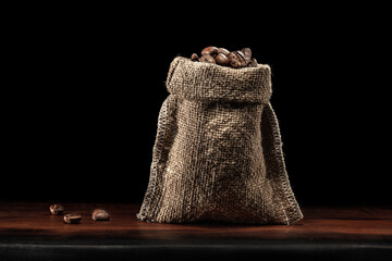 Classic Jute Bag Coffee Beans Standing On Wood Board Isolated.