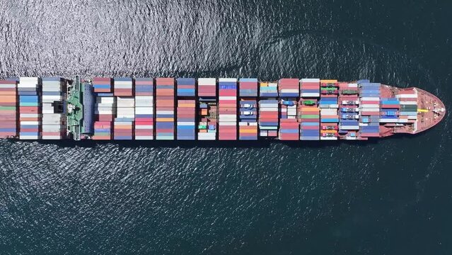 Overhead view of slow-moving container ship plying the trade routes around the Cape of Good Hope, South Africa. Loaded with freight containers