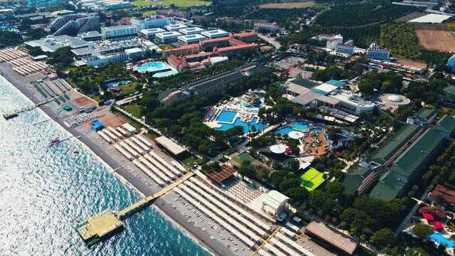 Aerial 4K drone footage of Kiriş-
Kemer (Antalya, Turkey).  Mediterranean sea, beach, cityscape (hotels and resorts), and mountains &ndash; filmed in a vibrant summer time.