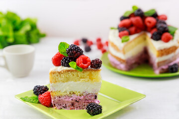 Fresh raspberries and blackberries are used to decorate this homemade berry cake.