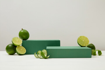 Bold green platforms and vibrant limes on a white background. Highlighting lemon extract as the...