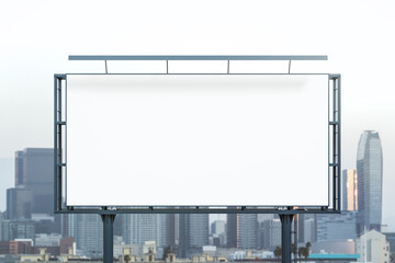 Obraz premium Blank white billboard on cityscape background at daytime, front view. Mock up, advertising concept