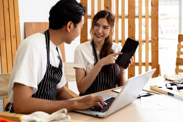 People Collaborating During Construction Break, Male and Female Workers Use Digital Devices to...