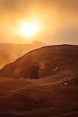 Fototapeta na wymiar Sunrise over a megalithic tomb 