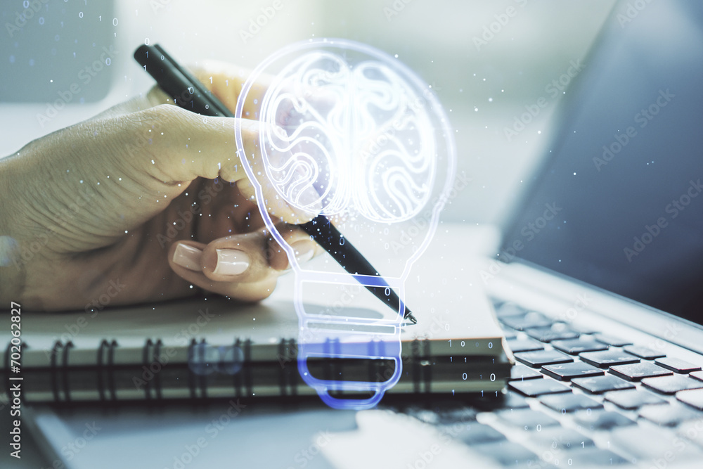 Poster Creative light bulb with human brain hologram and hand writing in notepad on background with laptop, artificial Intelligence and neural networks concept. Multiexposure