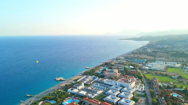 Aerial 4K drone footage of Kiriş-
Kemer (Antalya, Turkey).  Mediterranean sea, beach, cityscape (hotels and resorts), and mountains &ndash; filmed in a vibrant summer time.