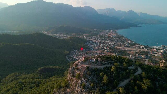 Aerial 4K drone footage of Kemer, Antalya, Turkey. Mesmerizing turquoise Mediterranean sea, cityscape, and mountains &ndash; a captivating visual asset captured in vibrant summer.time.
