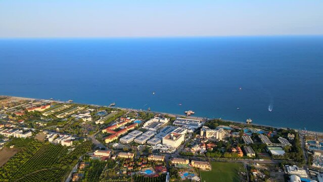 Aerial 4K drone footage of Kiriş-
Kemer (Antalya, Turkey).  Mediterranean sea, beach, cityscape (hotels and resorts), and mountains &ndash; filmed in a vibrant summer time.