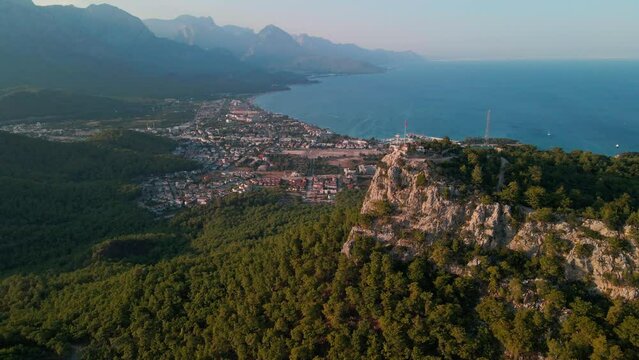 Aerial 4K drone footage of Kemer, Antalya, Turkey. Mesmerizing turquoise Mediterranean sea, cityscape, and mountains &ndash; a captivating visual asset captured in vibrant summer.time.