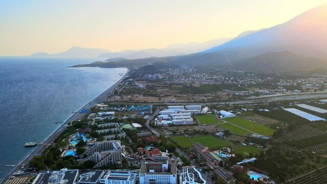 Aerial 4K drone footage of Kiriş-
Kemer (Antalya, Turkey).  Mediterranean sea, beach, cityscape (hotels and resorts), and mountains &ndash; filmed in a vibrant summer time.