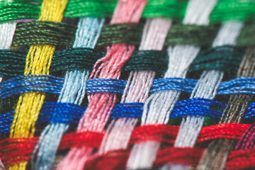 Braid of colored sewing threads - Powered by Adobe