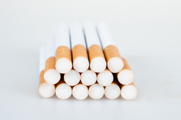 Fototapeta na wymiar Cigarettes pyramid with a brown filter